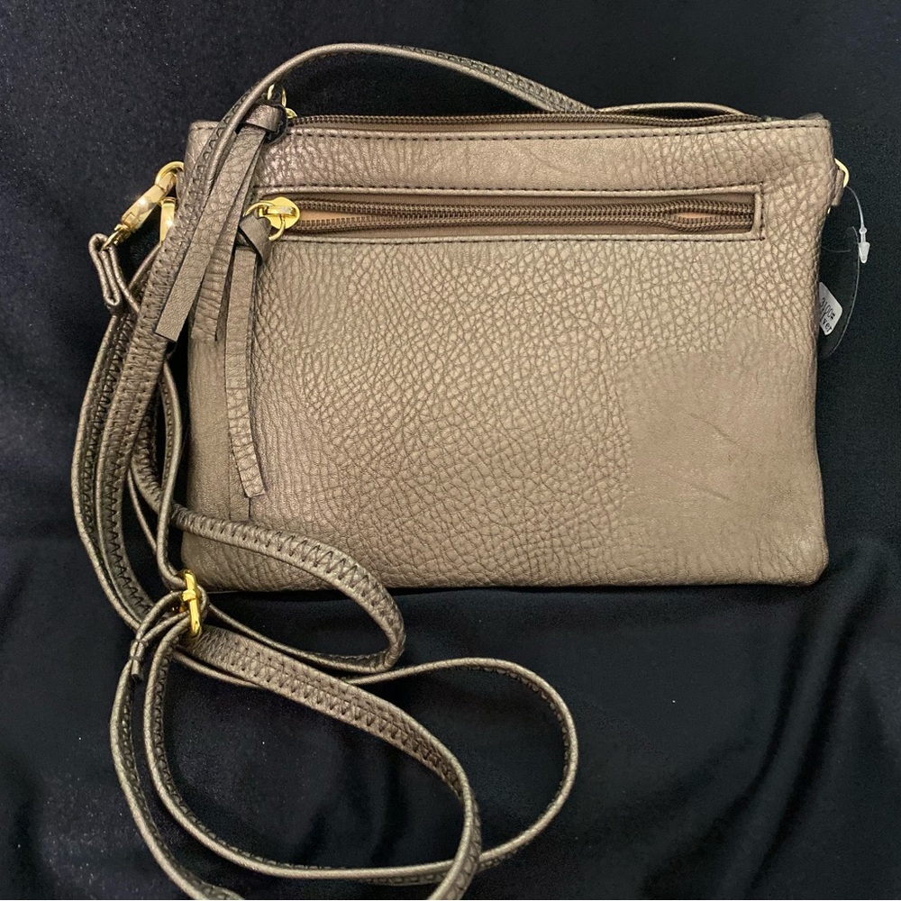 Golden shimmer brand new versatile handbag.